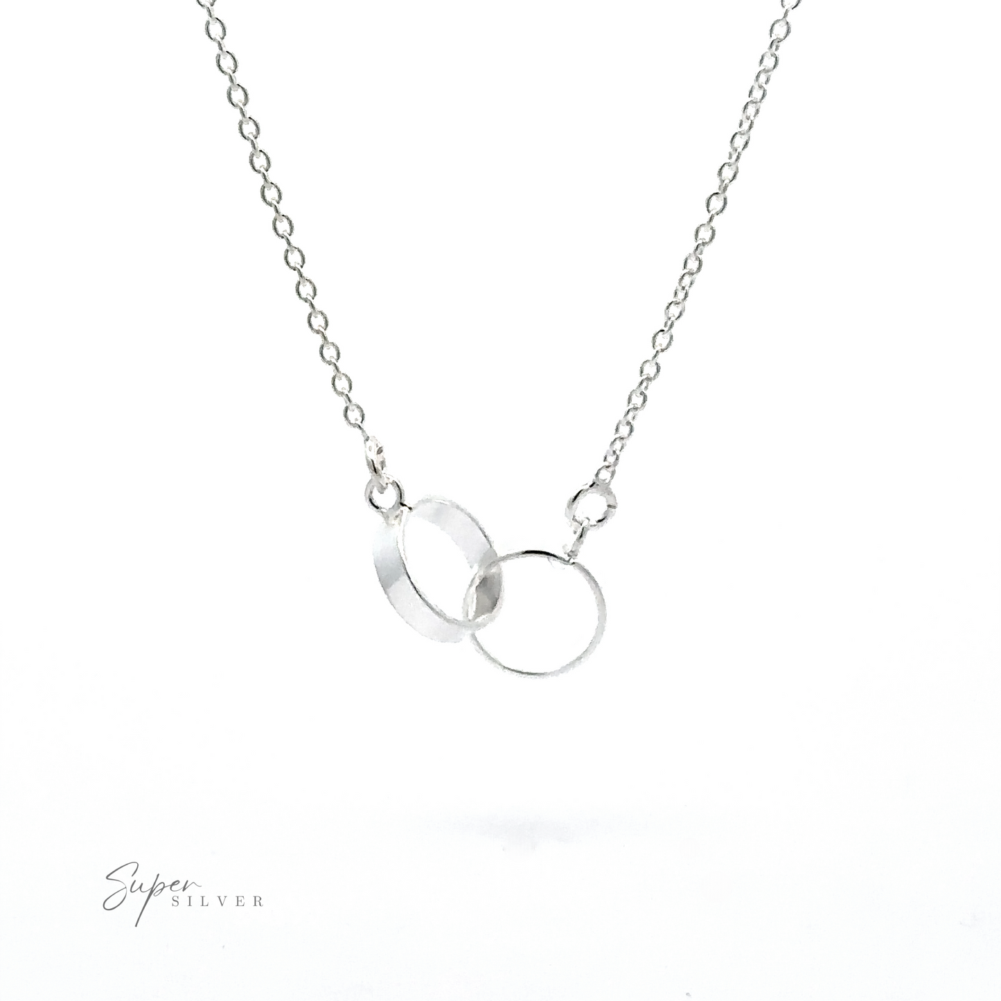 A Double Circle Necklace featuring two delicate interlocking rings on a fine chain, symbolizing an eternal bond. The image includes the logo "Super Silver" on the bottom left corner.