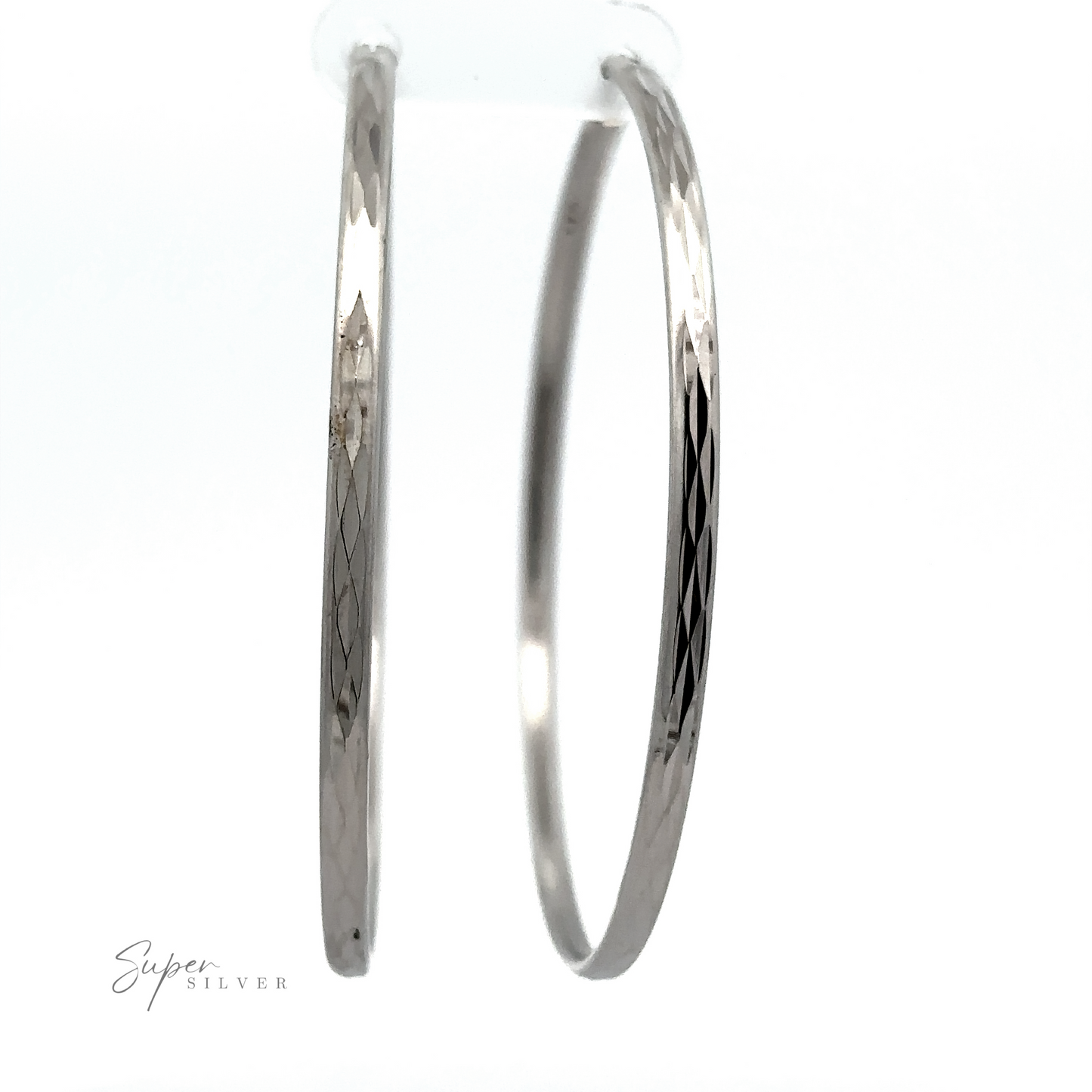 
                  
                    Two Flashy 60mm Diamond Faceted Hoops with etched designs, displayed against a white background with a "super silver" signature at the bottom.
                  
                
