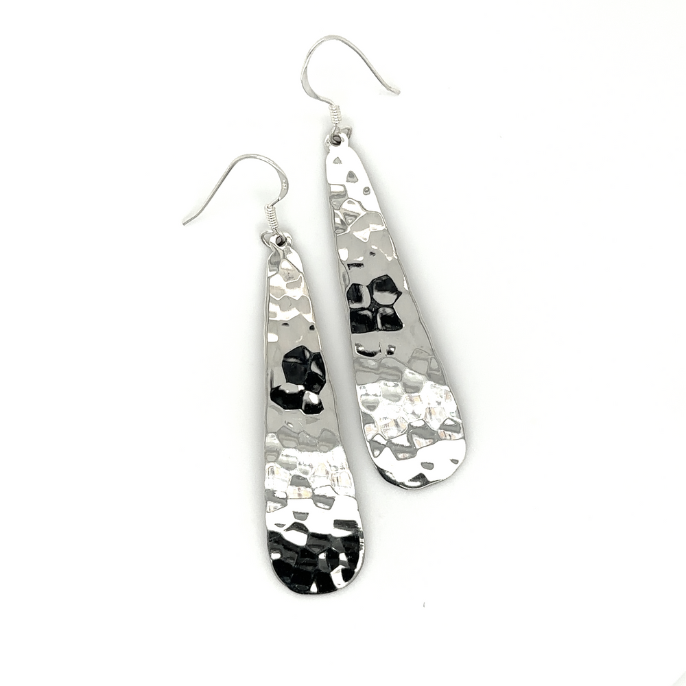 
                  
                    A pair of stunning Super Silver Hammered Teardrop Earrings with a high shine finish and hammered texture.
                  
                