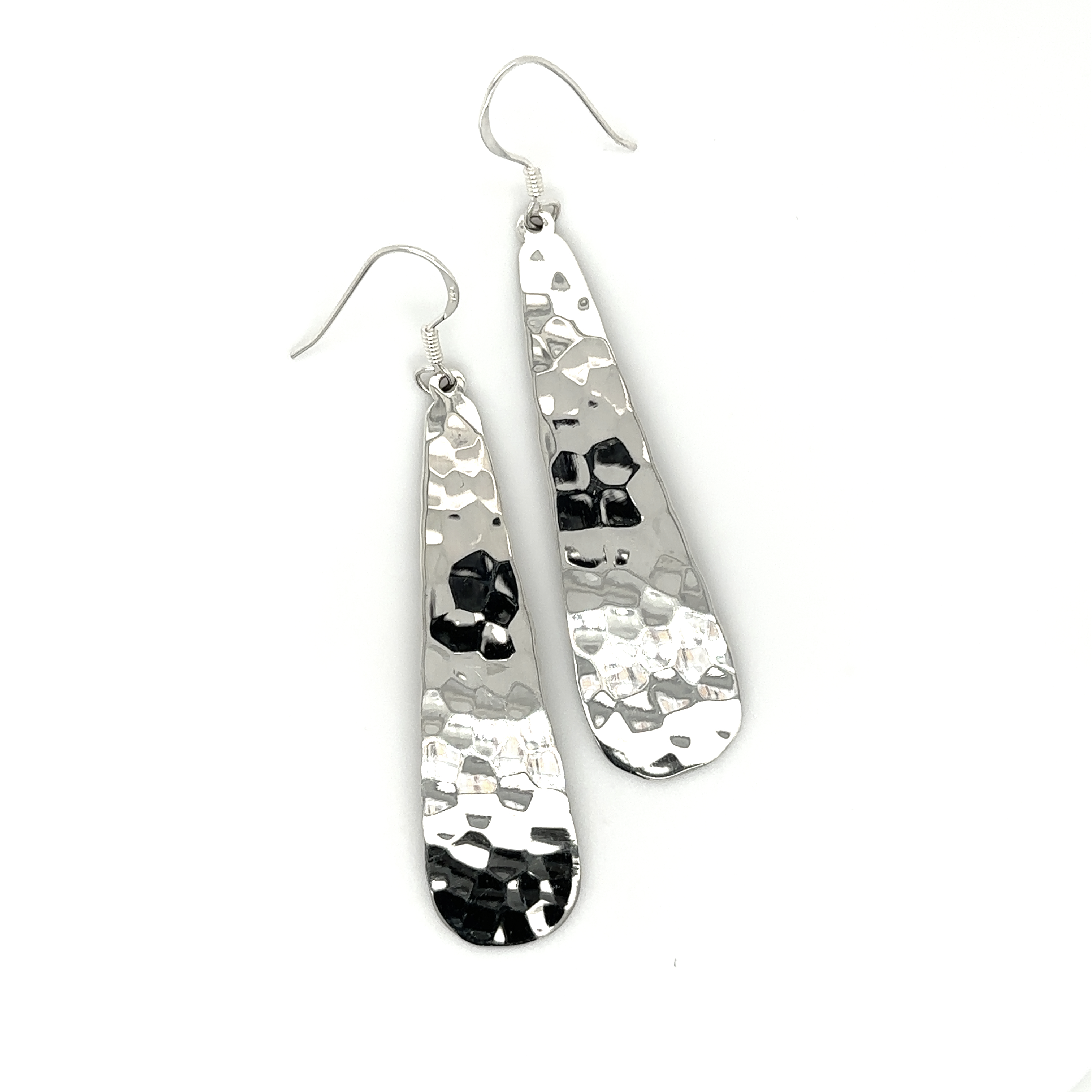 A pair of stunning Super Silver Hammered Teardrop Earrings with a high shine finish and hammered texture.