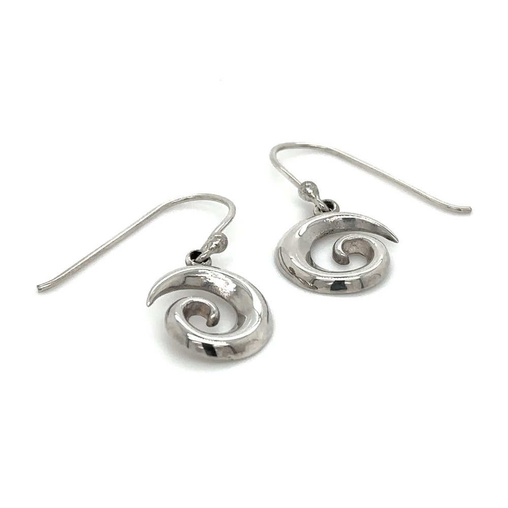 A pair of Super Silver Silver Swirl Earrings.
