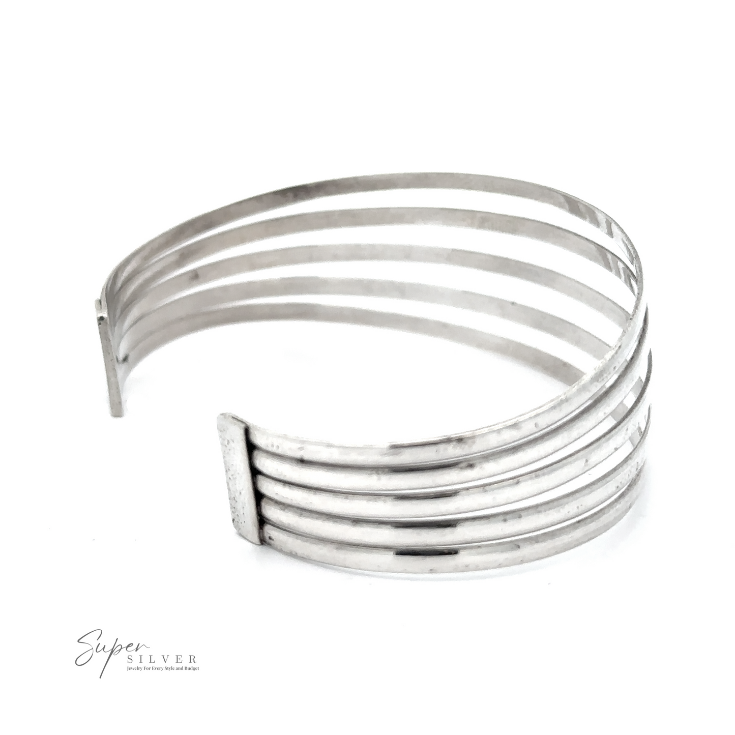 A fashionable Simple Cuff with Open Design featuring parallel horizontal bars and an open end design. Crafted from .925 Sterling Silver, the silver cuff boasts the "Super Silver" logo printed in the lower left corner, exuding a modern chic appeal.