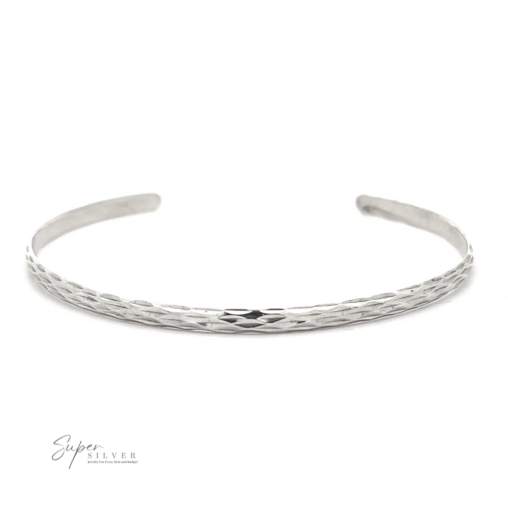 A thin, textured sterling silver bracelet with an open end design, displayed on a white background. Logo text in the bottom left corner reads "Super Silver." This Glittering Diamond Cut Cuff Bracelet exudes elegance and simplicity.