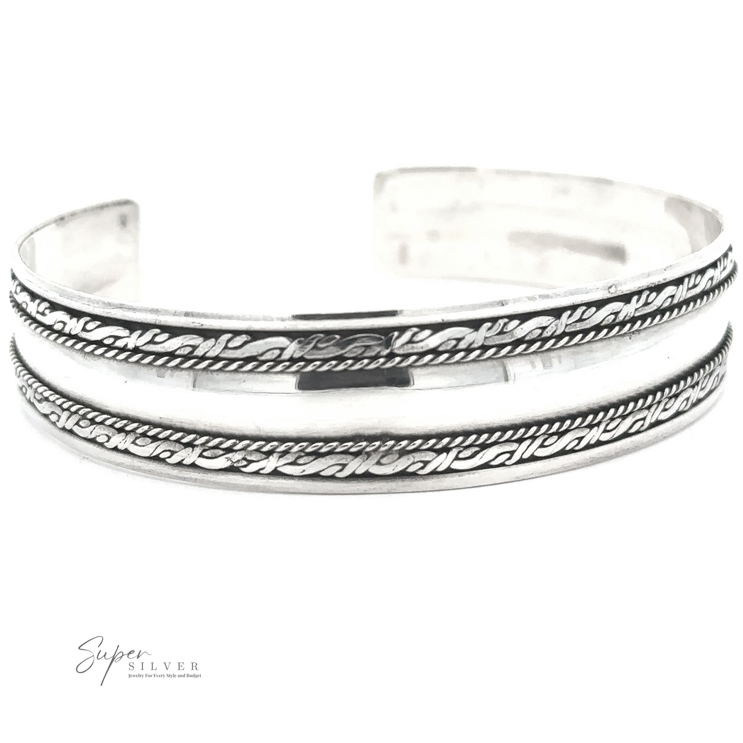 A handmade Silver Domed Cuff with Rope Pattern featuring two parallel engraved lines and a rope pattern in between. The brand "Super Silver" is visible in the bottom left corner, reminiscent of the exquisite craftsmanship found in Bali.
