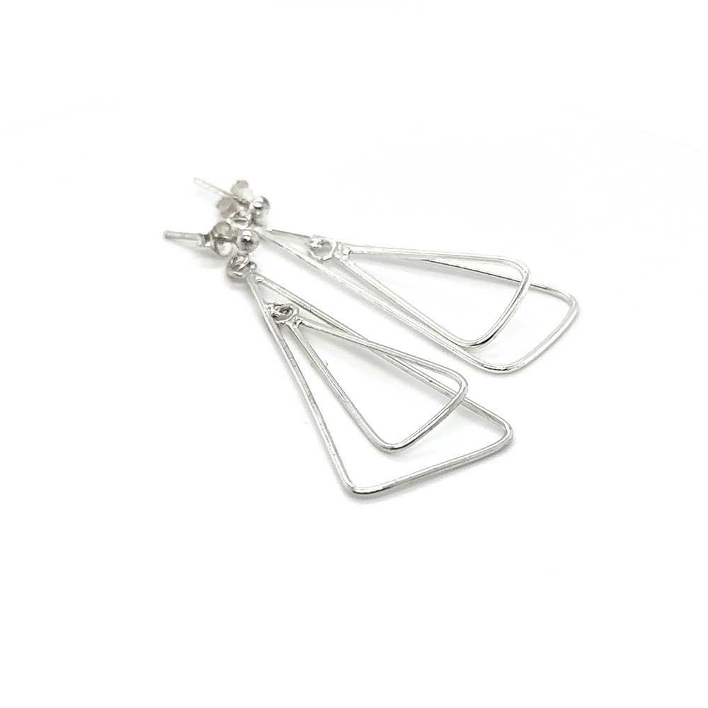 
                  
                    A pair of Simple Nesting Triangle Drop Post Earrings by Super Silver on a white background, crafted with Sterling Silver.
                  
                