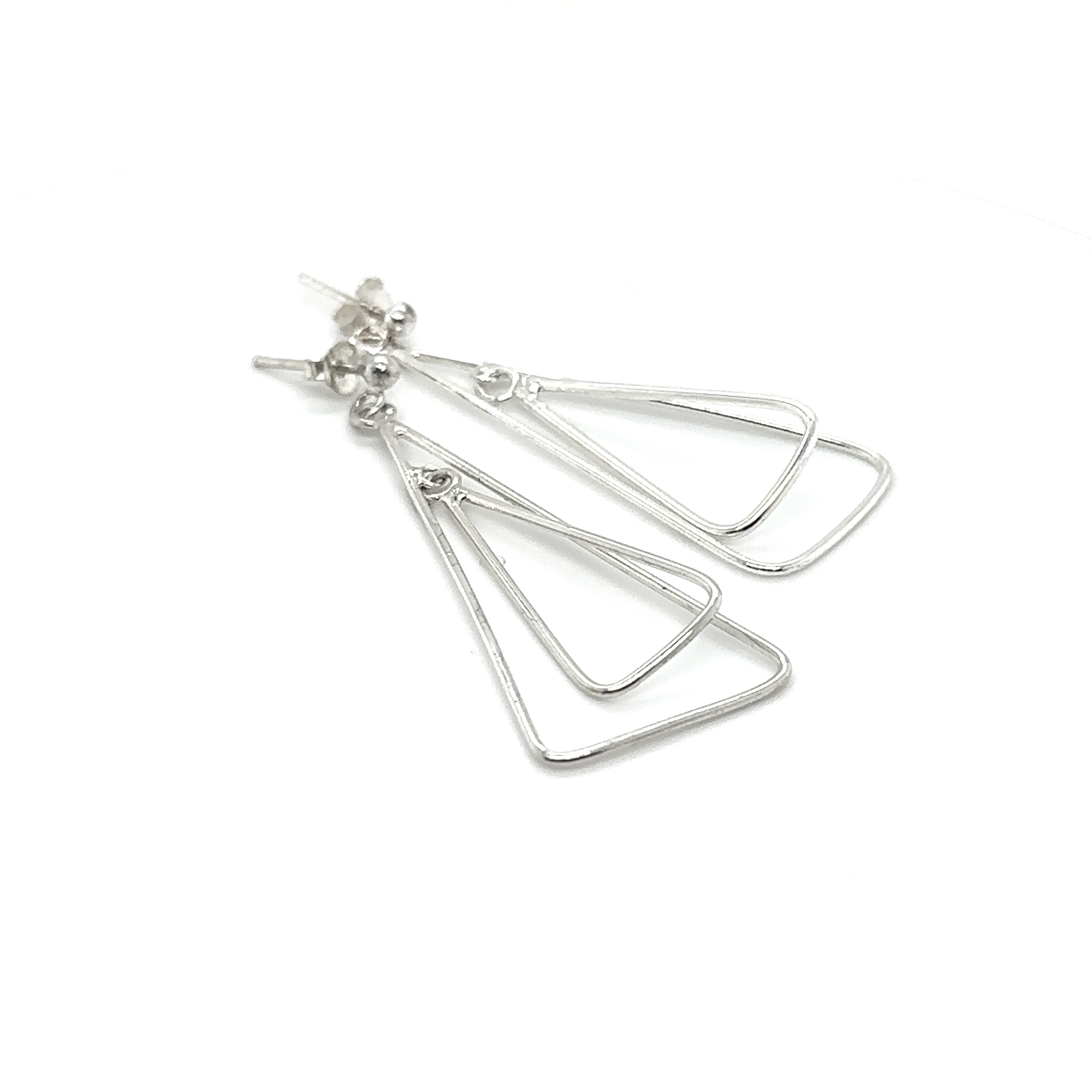 A pair of Simple Nesting Triangle Drop Post Earrings by Super Silver on a white background, crafted with Sterling Silver.