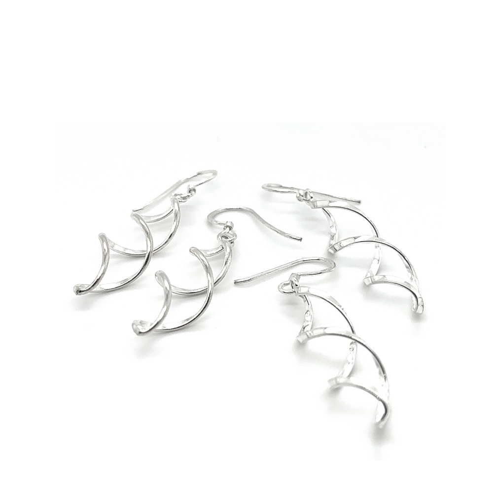 These Super Silver Delicate Twisted Earrings are the perfect everyday accessory with their elegant curved shape.