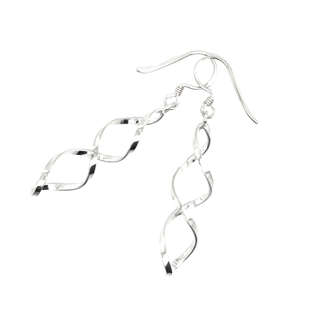 
                  
                    A pair of Delicate Twisted Earrings by Super Silver on a white background.
                  
                