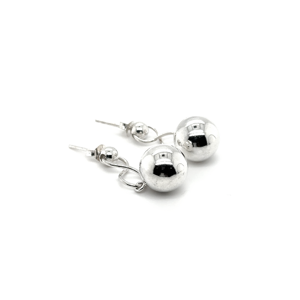 
                  
                    A pair of Super Silver Dangly Silver Ball Earrings with an infinity loop design, showcased on a white background.
                  
                