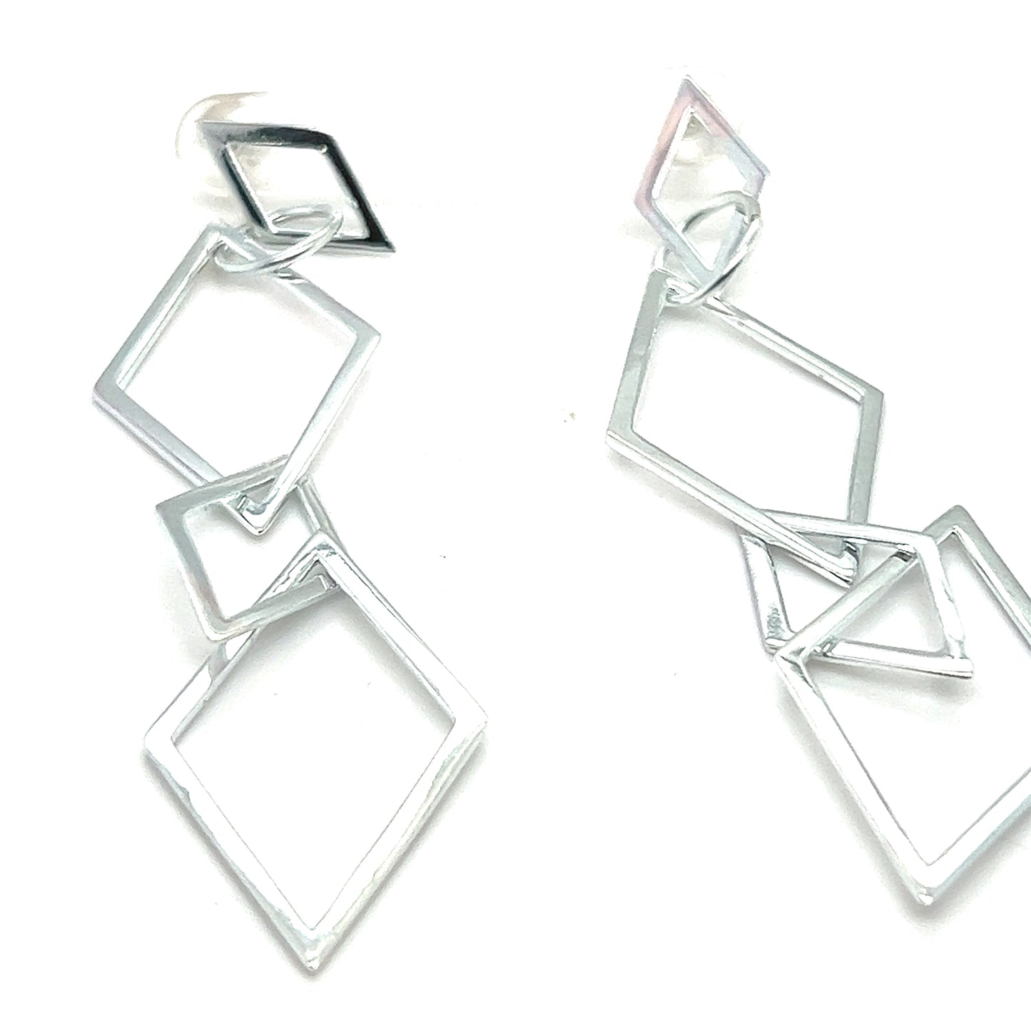 
                  
                    Super Silver's Long Interconnected Diamond Shaped Earrings with contemporary elegance.
                  
                