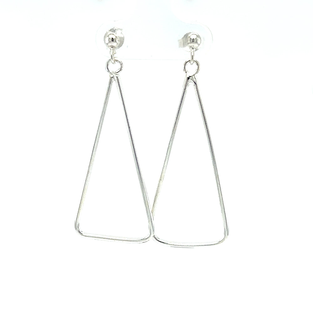 
                  
                    A pair of Super Silver wire triangle earrings, showcasing minimalist fashion, placed on a white background.
                  
                