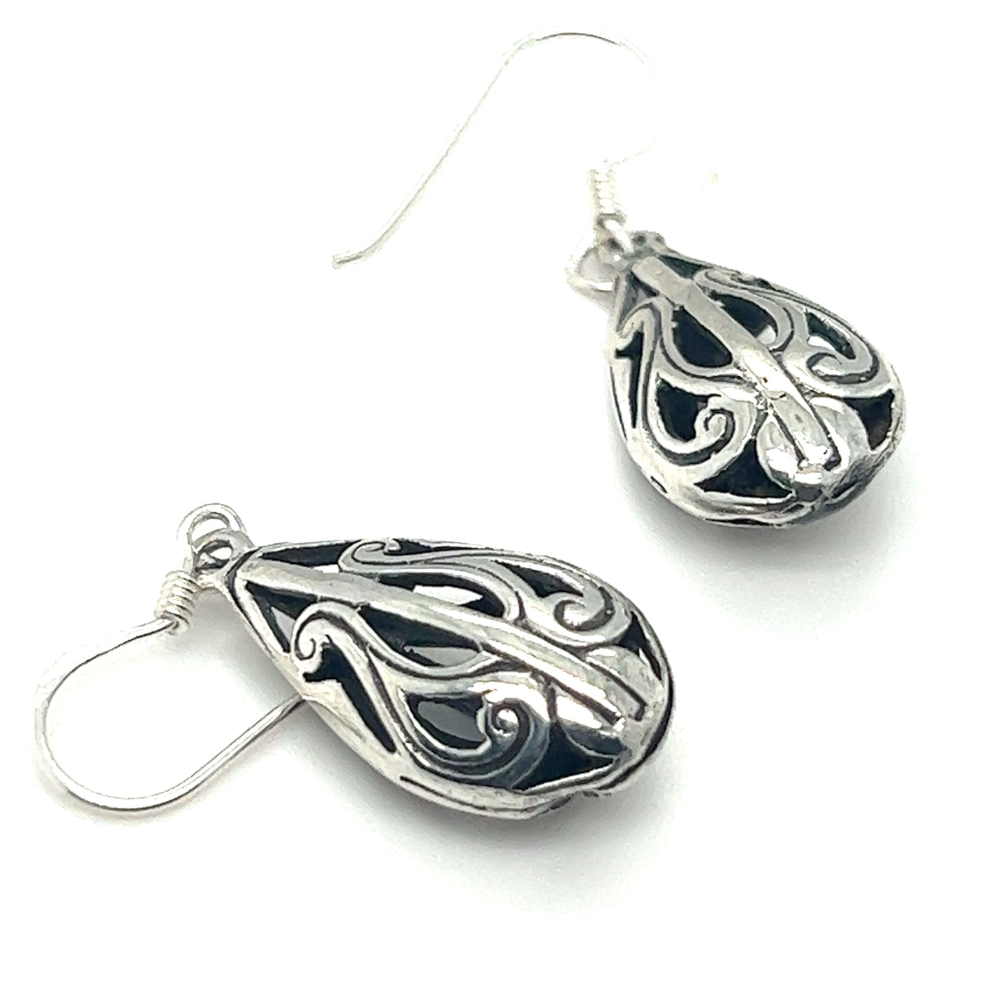 A pair of Super Silver Filigree Teardrop Earrings with an ornate design.