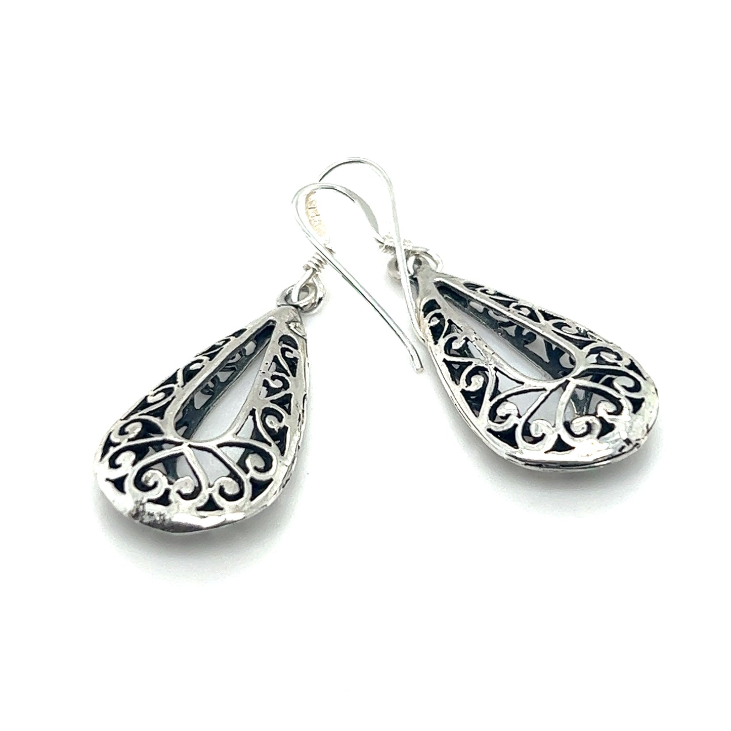 Add bohemian flair to your collection with these stunning Super Silver Filigree Teardrop Earrings with Open Center. Featuring a delicate filigree setting, these earrings are the perfect accessory for any outfit.