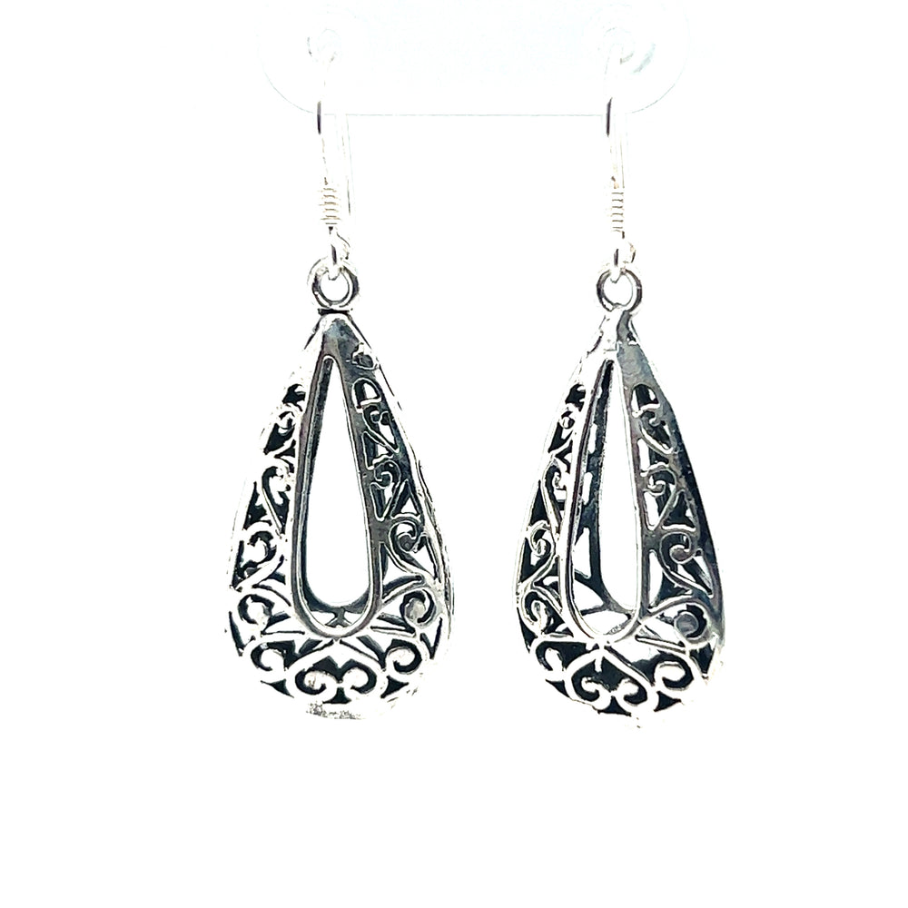 
                  
                    A pair of Super Silver Filigree Teardrop Earrings with Open Center, adding a bohemian flair to any outfit.
                  
                