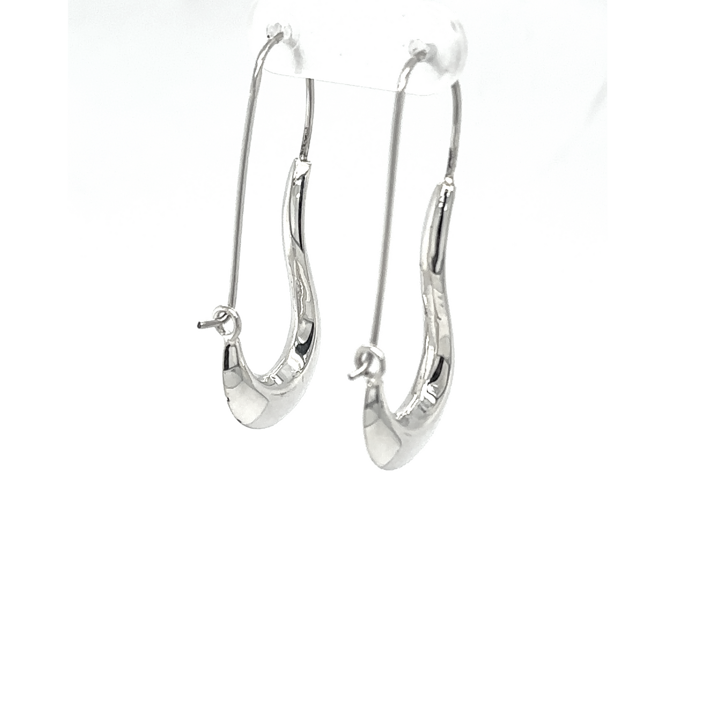 
                  
                    A pair of Curved Hoop Earrings on a white background.
                  
                
