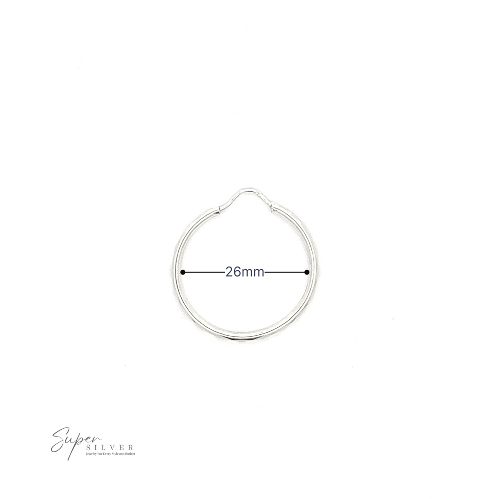 
                  
                    1.5mm Faceted Silver Infinity Hoops with a 26mm diameter measurement indicated, displayed on a white background with "super silver" signature at the bottom, featuring a rhodium finish.
                  
                