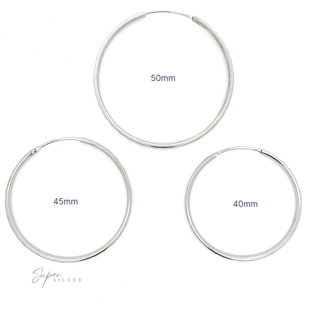 
                  
                    Three 3mm Chevron Faceted Hoop earrings displayed in decreasing sizes with measurements indicated: 50mm, 45mm, and 40mm, against a white background.
                  
                