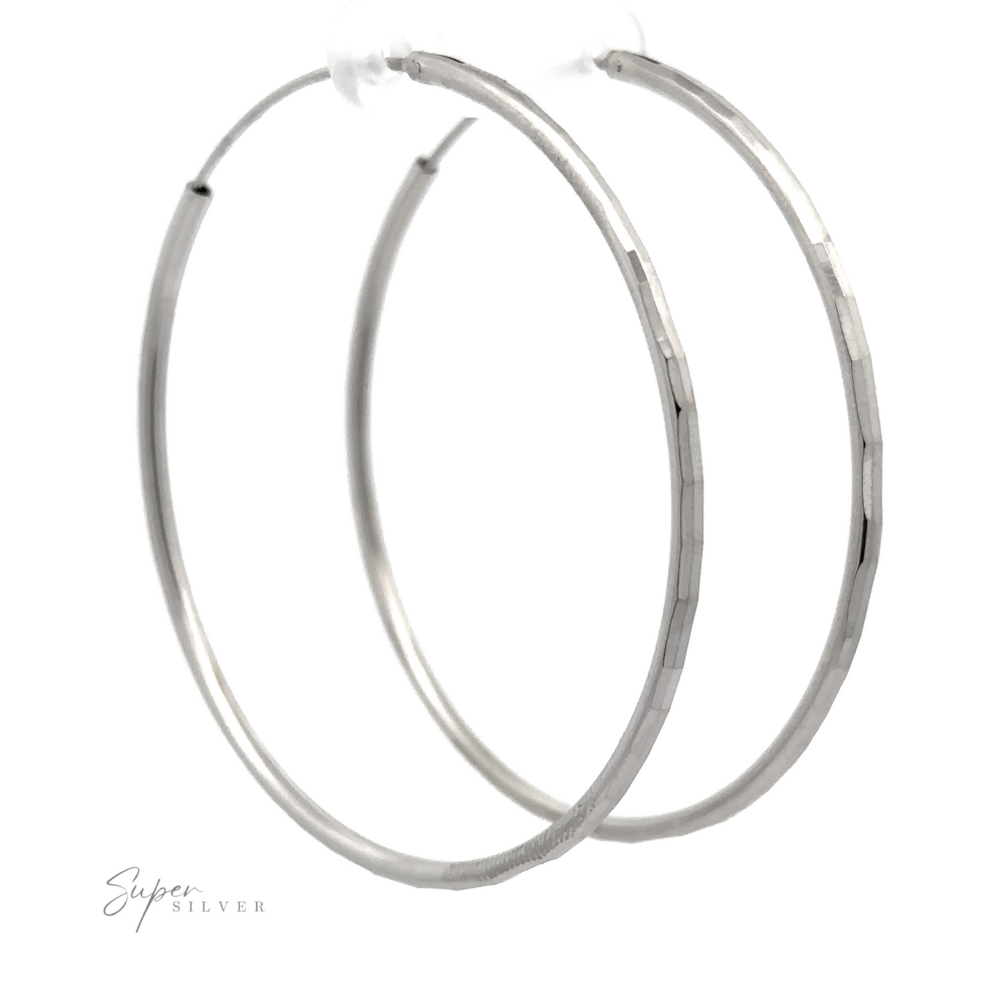 
                  
                    A pair of 2mm Diamond Cut Hoop Earrings with a diamond faceted texture, displayed against a white background with a faint "super silver" signature at the bottom left.
                  
                