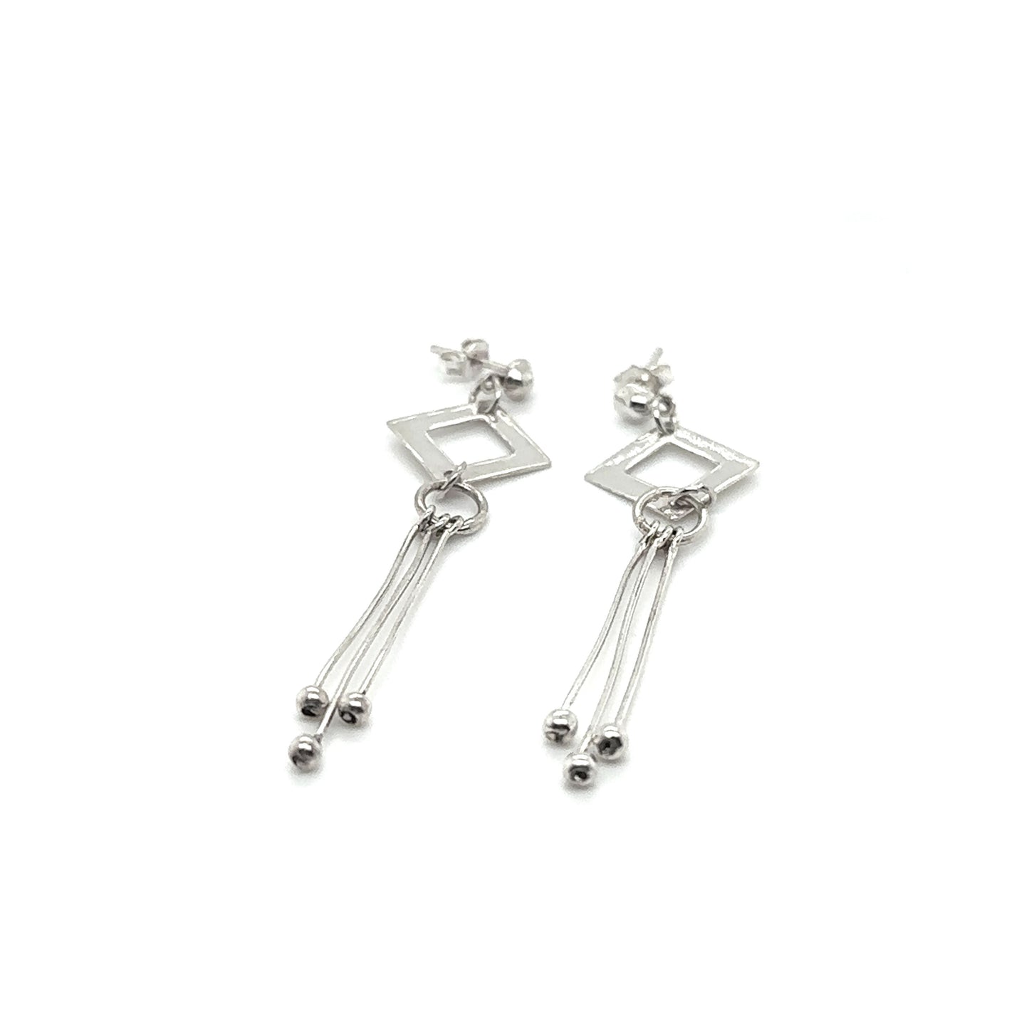 
                  
                    A pair of Diamond Shaped Post Earrings with Tassel by Super Silver.
                  
                