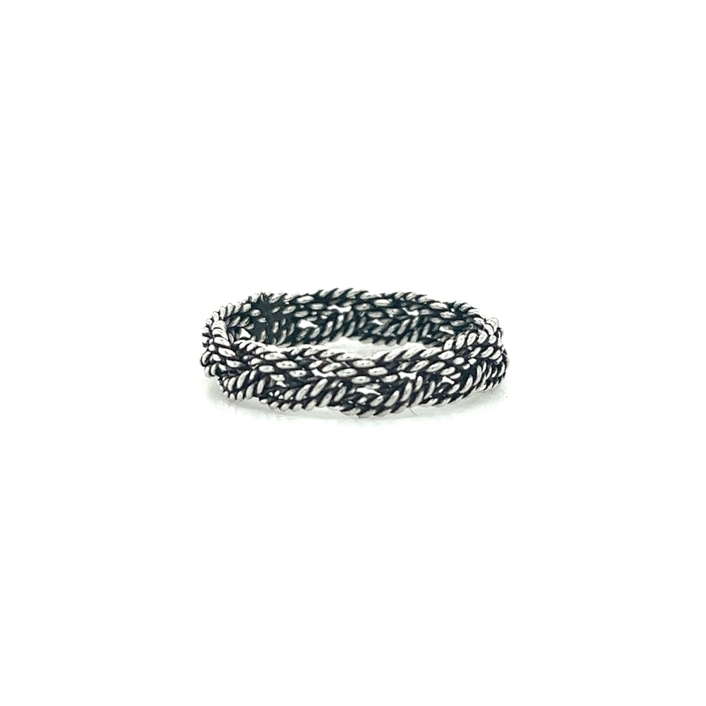 A Super Silver Twisted Rope Band Ring with an artisanal craftsmanship dark oxidized finish on a white surface.