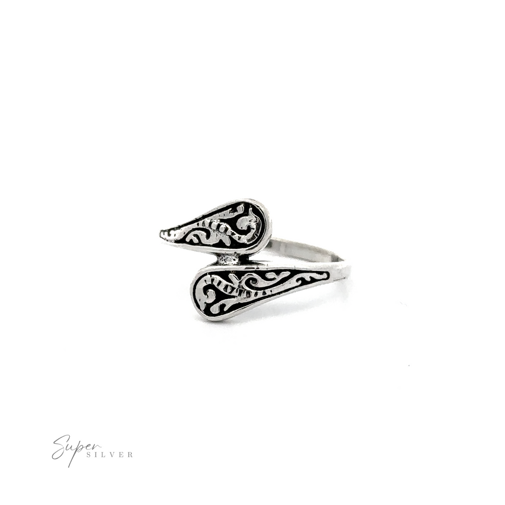 
                  
                    A Dainty Spoon Ring with an ornate swirl design and oxidized finish.
                  
                