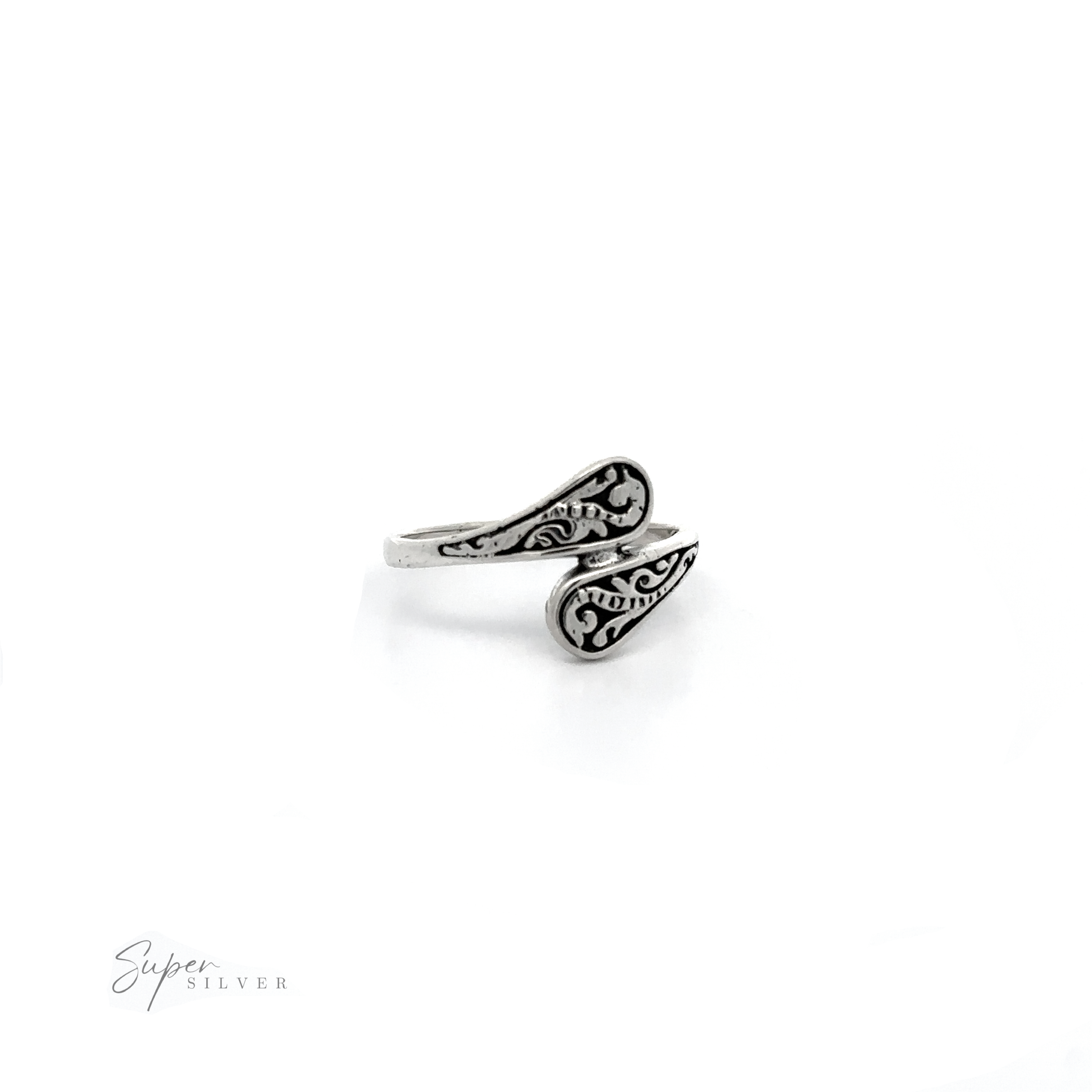 A Dainty Spoon Ring with an ornate swirl design.