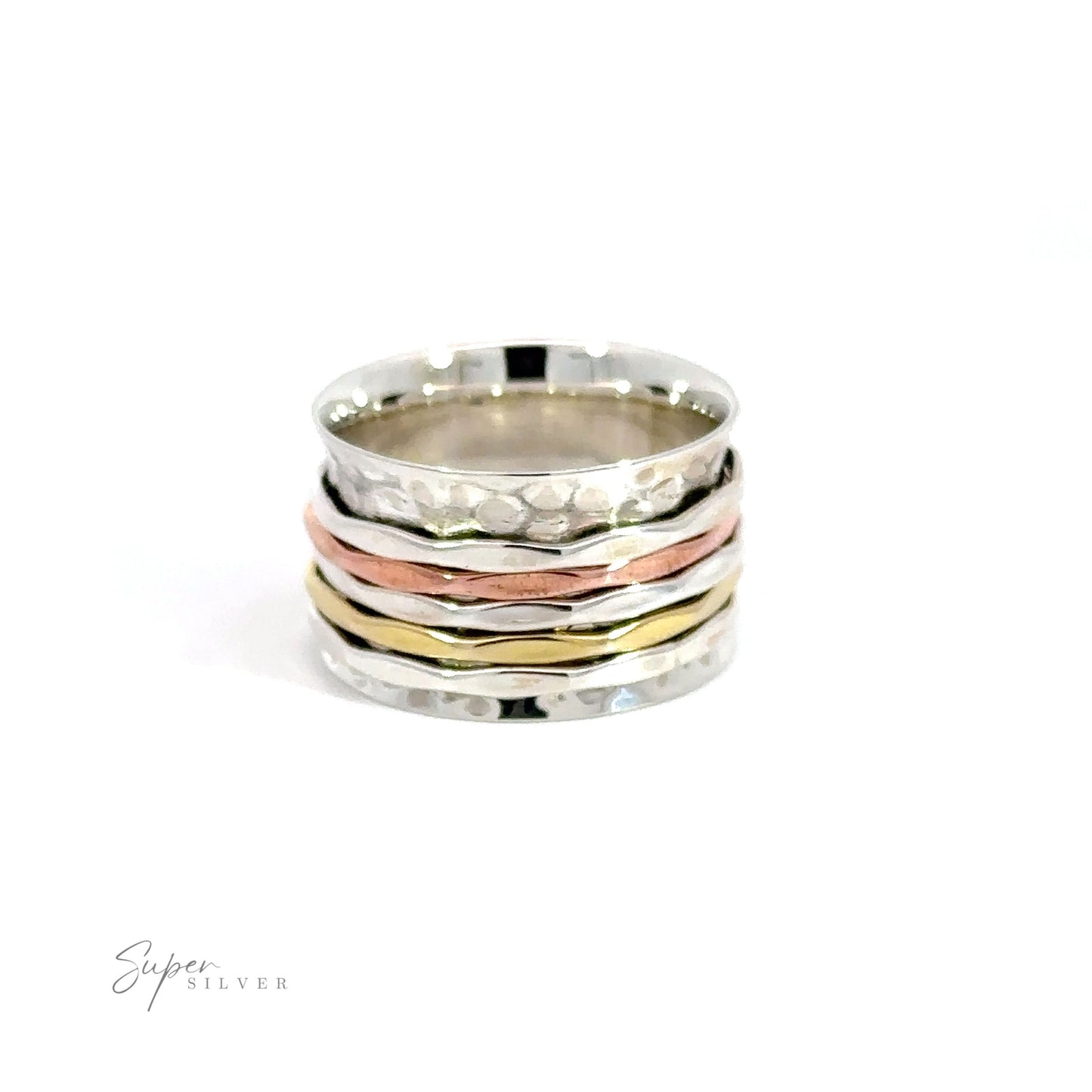 A Handmade Hammered Tricolor Spinner Ring featuring a mixed metal piece of sterling silver, gold, and copper.
