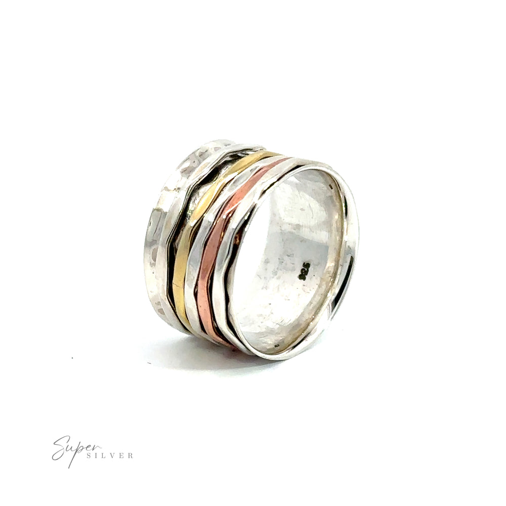 A Handmade Hammered Tricolor Spinner Ring.