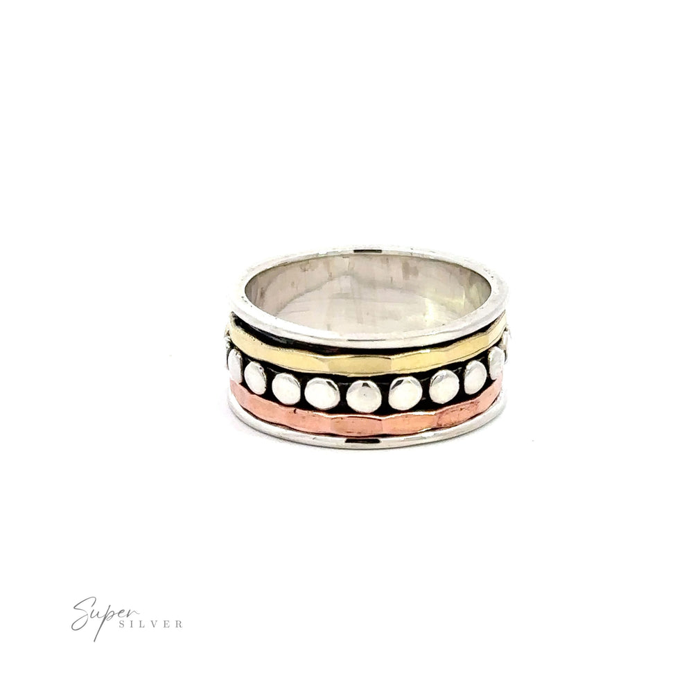 A Tricolor Handmade Spinner Ring with Dots including 925 Sterling Silver.