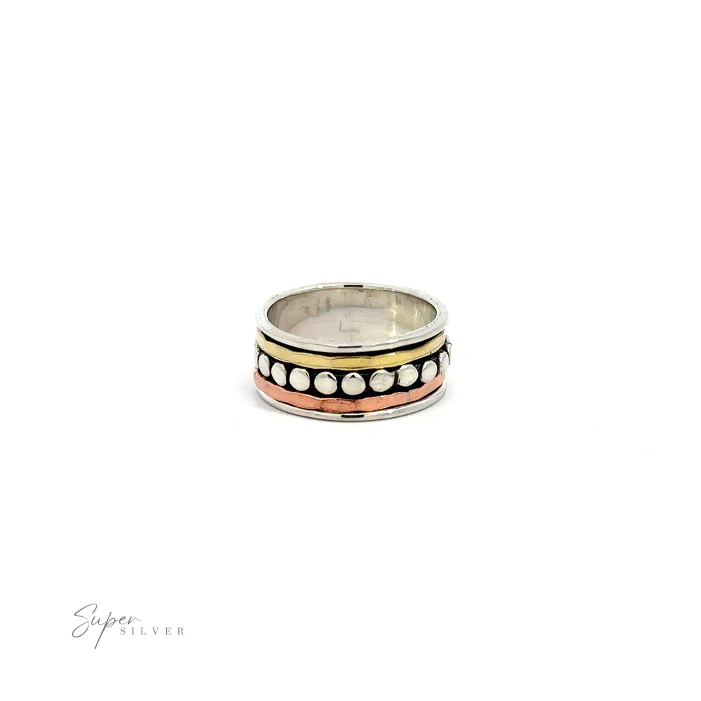 
                  
                    A Tricolor Handmade Spinner Ring with Dots from our mixed metal bands jewelry collection, featuring a combination of silver and gold with white and black beads.
                  
                
