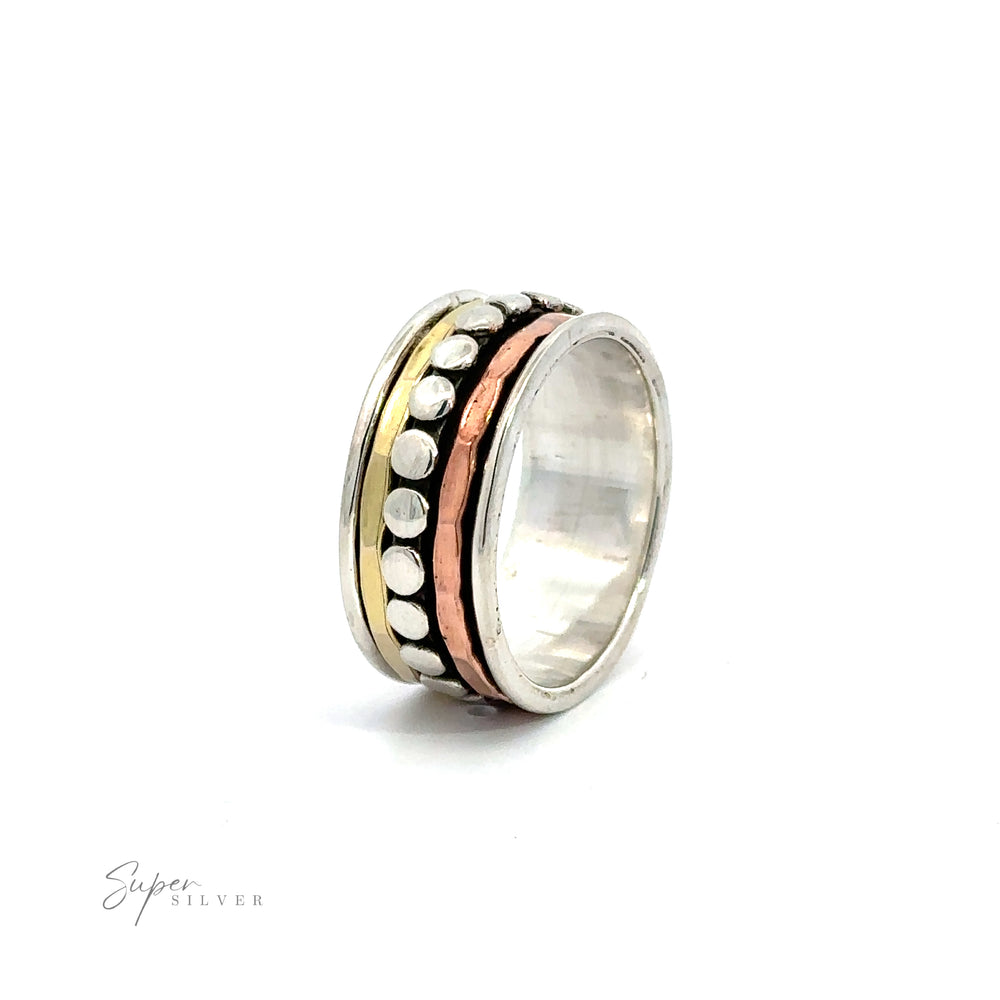 A handcrafted Tricolor Handmade Spinner Ring with Dots adorned with a central bead, making it a unique addition to any jewelry collection.