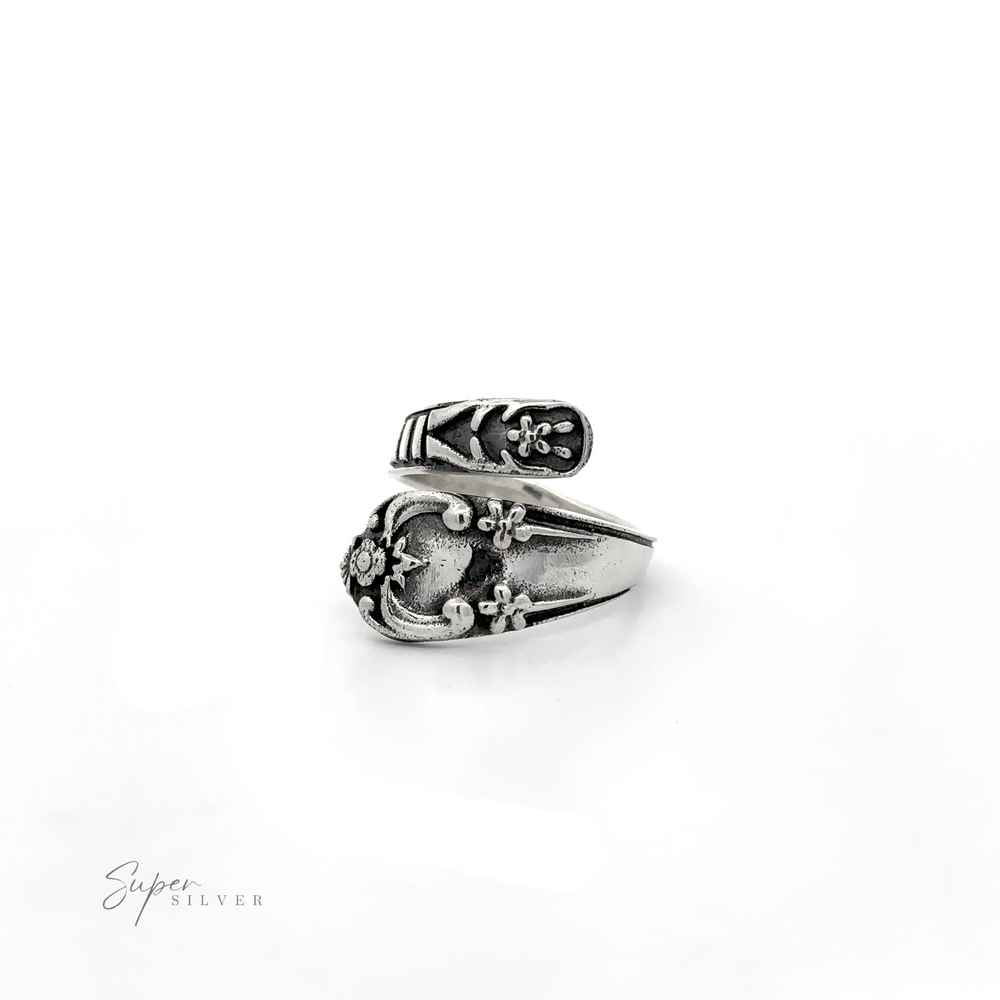 
                  
                    A Spoon Design Ring with a .925 Sterling Silver flower on an adjustable band.
                  
                