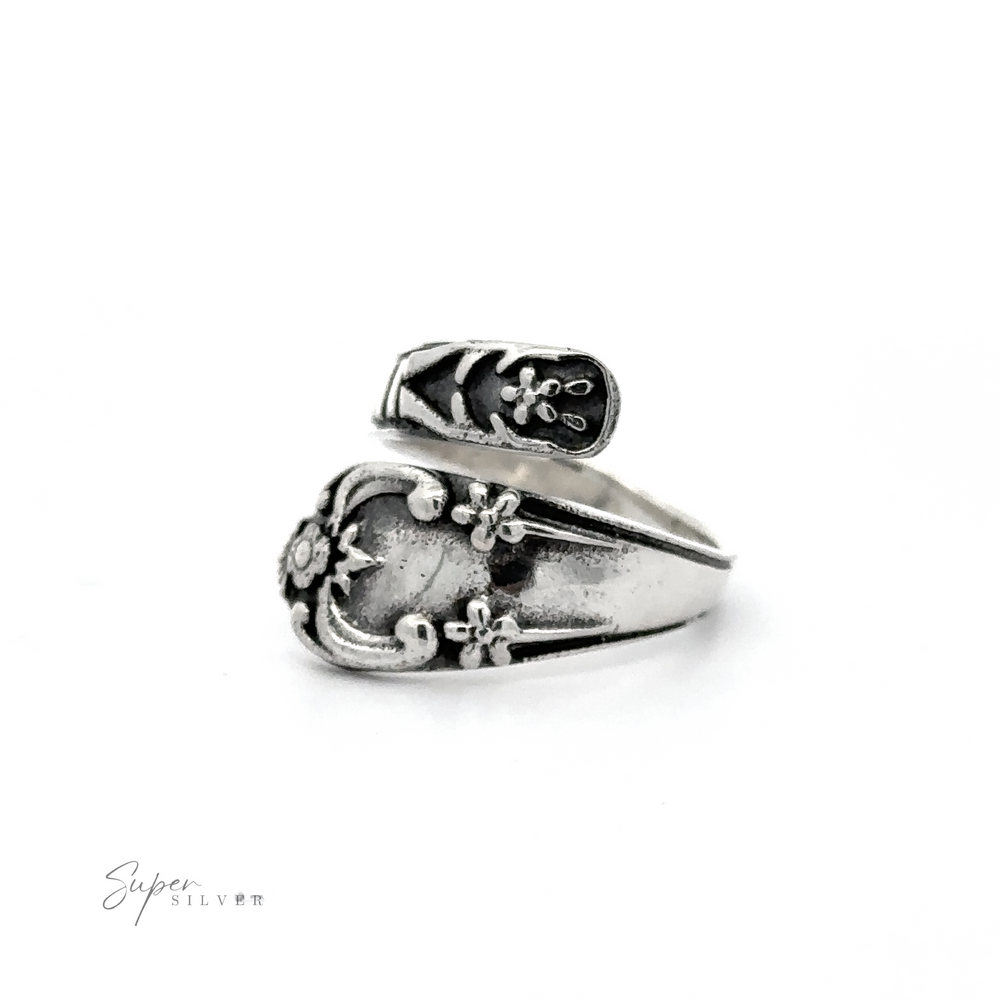
                  
                    A Spoon Design Ring with an adjustable band and a design on it, made of .925 Sterling Silver.
                  
                