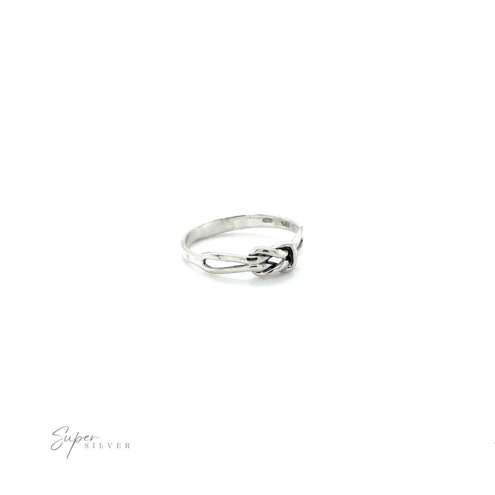 
                  
                    A Slender Square Knot Ring with a flower on it.
                  
                