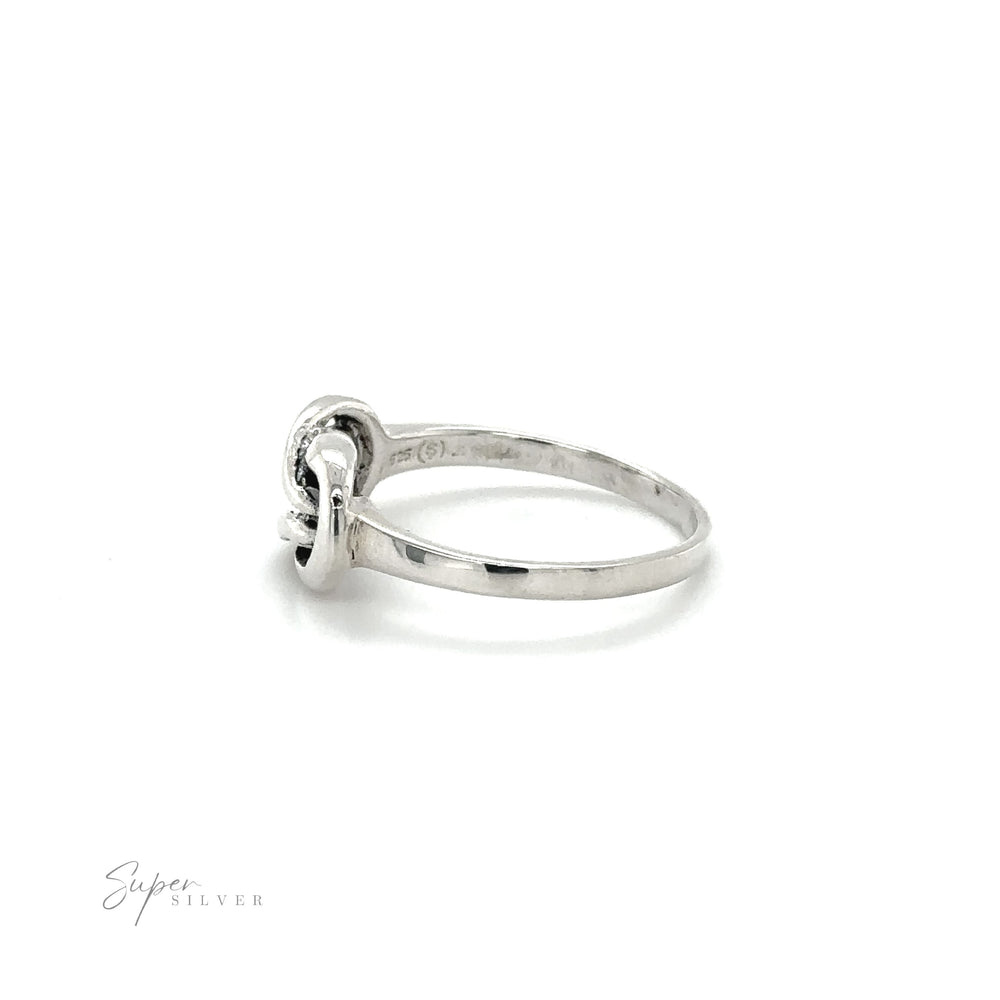 
                  
                    A Solid Knot Ring with a powerful diamond in the center.
                  
                