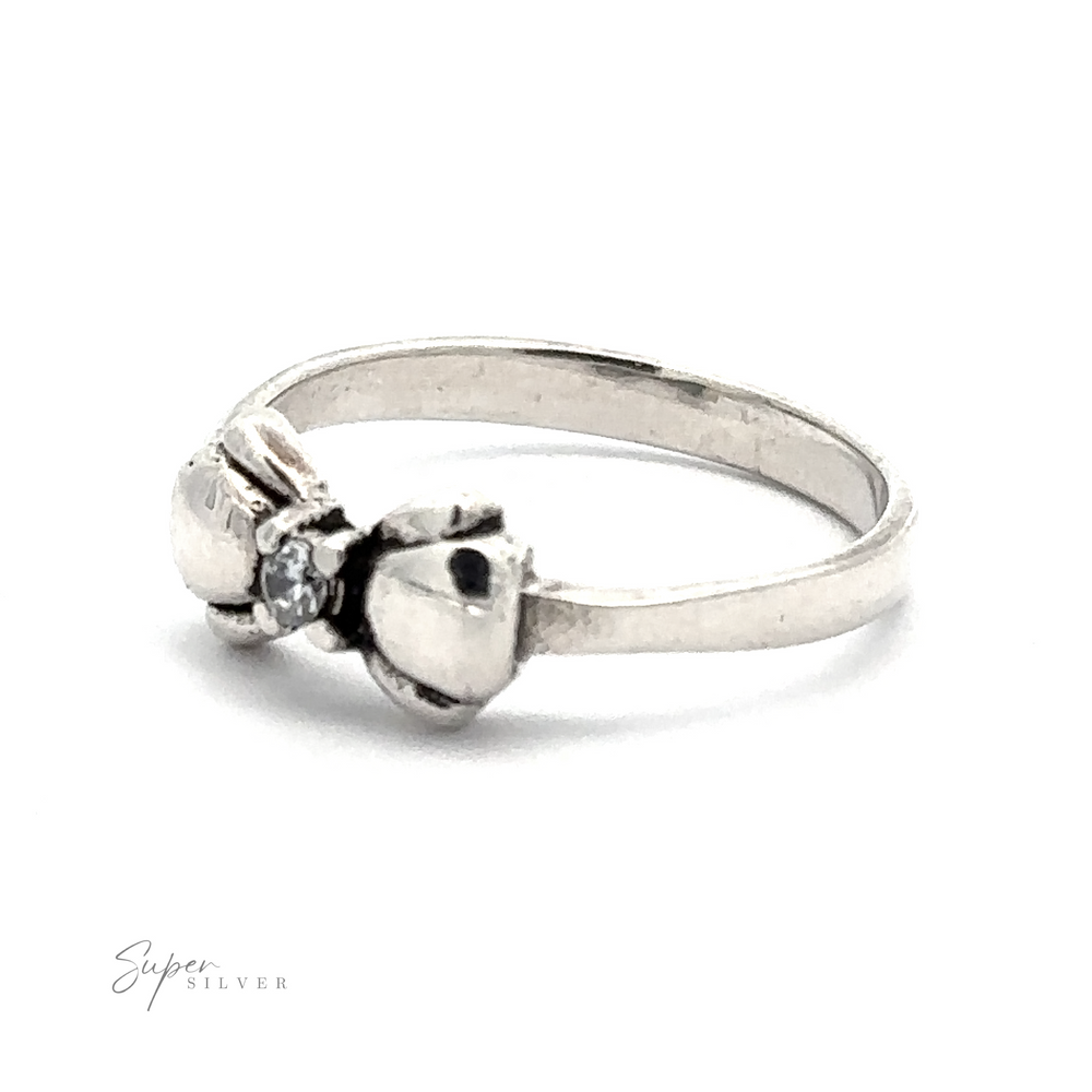 
                  
                    An Adorable Cubic Zirconia Bow Ring featuring a small round black cubic zirconia at its center. The inscription "Super Silver" is delicately placed in the bottom left corner.
                  
                