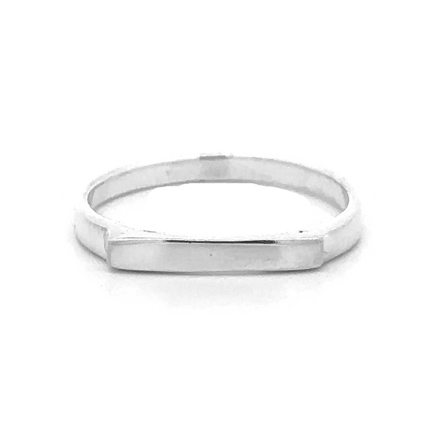 
                  
                    A Dainty Silver Bar Ring with a rectangular flat surface at the front, shown against a plain white background, epitomizes modern minimalism.
                  
                