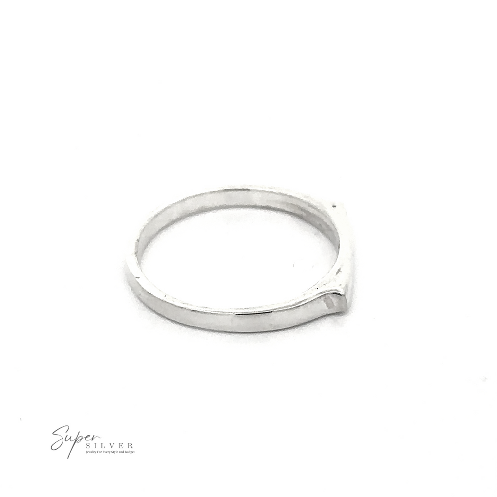 
                  
                    A Dainty Silver Bar Ring is displayed against a white background. Embracing modern minimalism, the ring features a simple and minimalist design. The logo "Super Silver" is visible in the bottom left corner.
                  
                