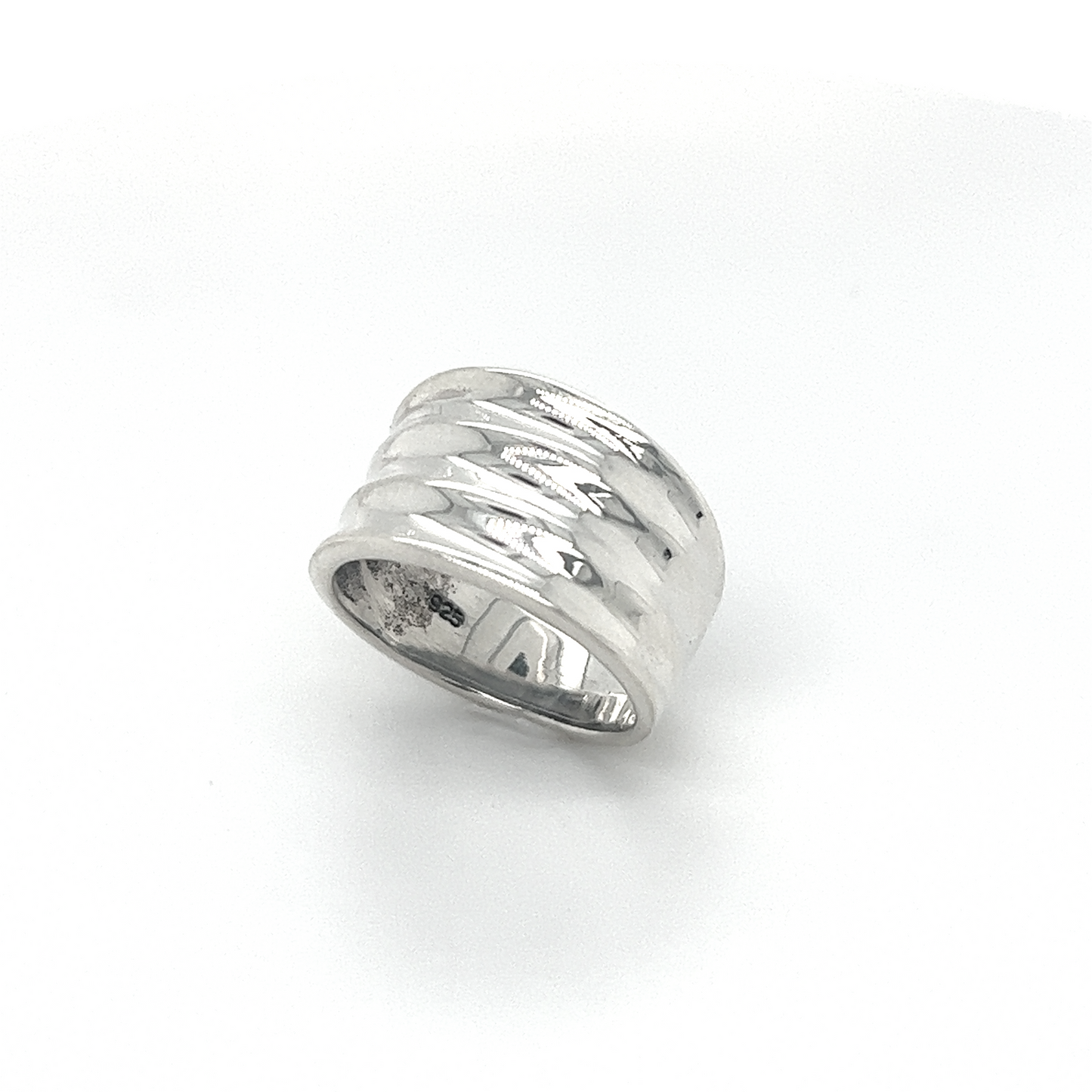 
                  
                    A textured Super Silver Wide Tapered Band ring with a fashionable design.
                  
                