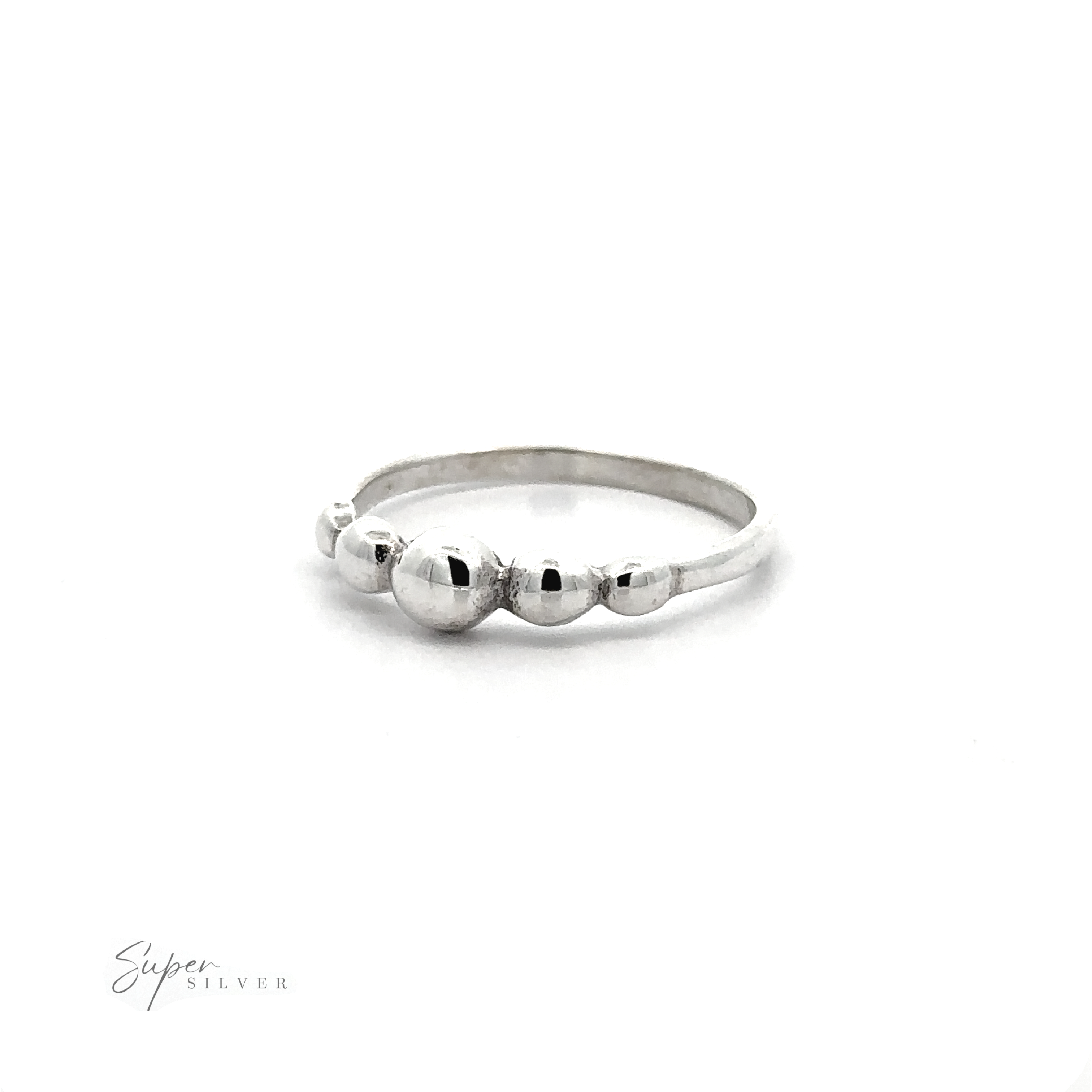 A modern Dainty Graduated Silver Ball Ring with a tactile experience.