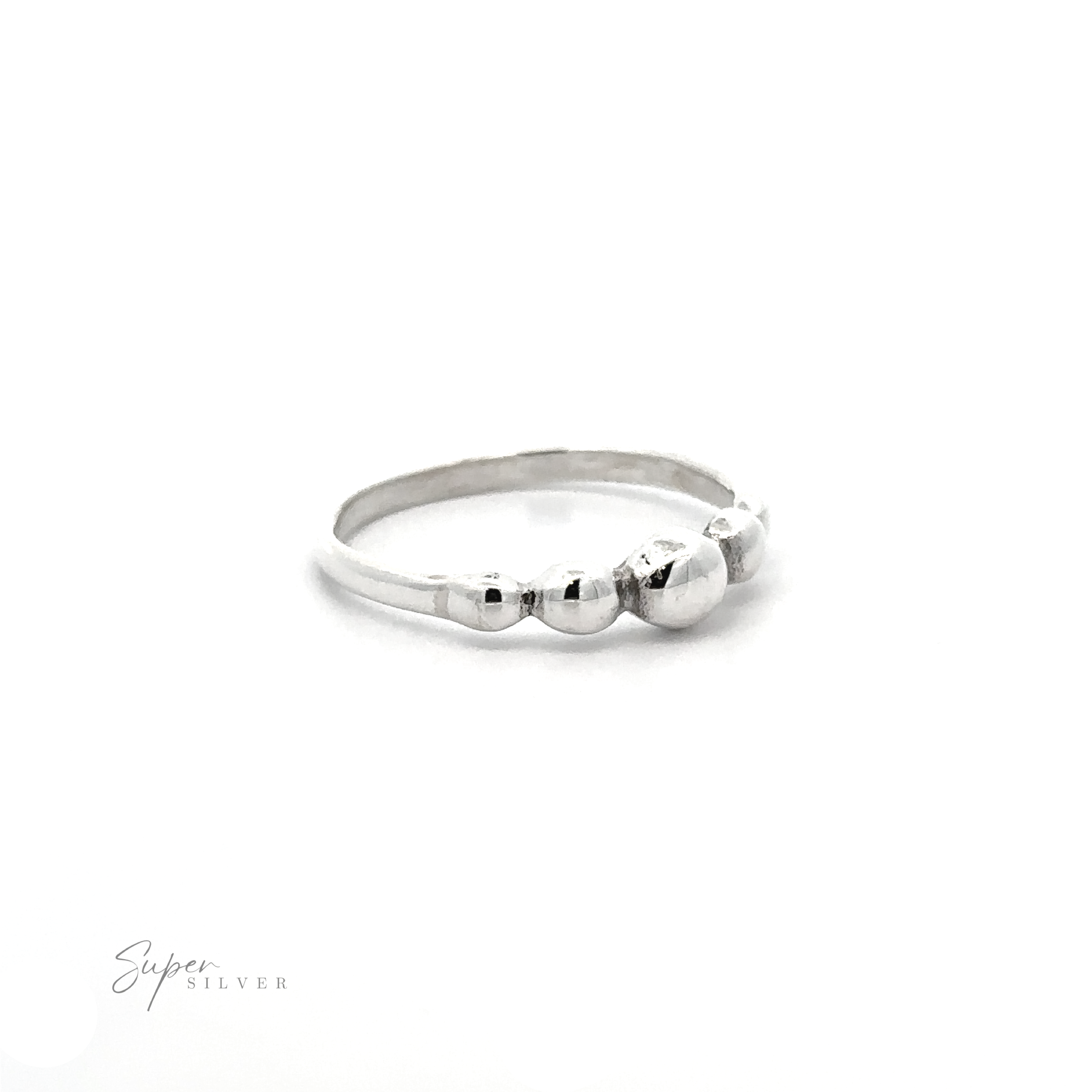 A Dainty Graduated Silver Ball Ring with a modern design, providing a tactile experience with three balls.
