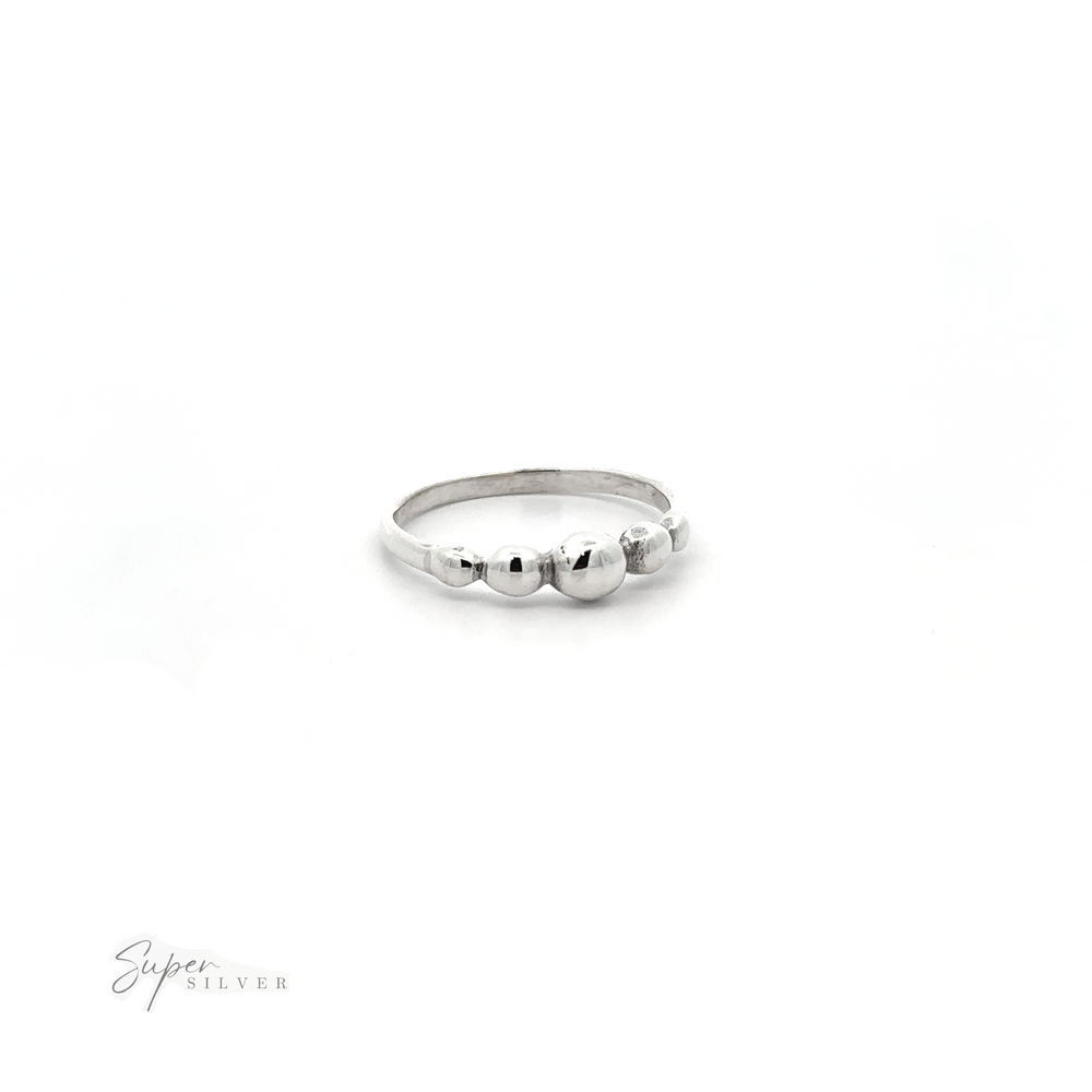 
                  
                    A modern design Dainty Graduated Silver Ball Ring adorned with three graduated balls.
                  
                