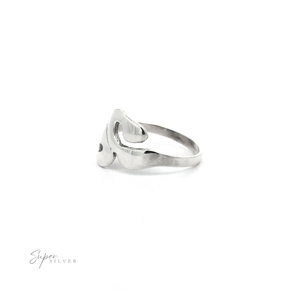 
                  
                    A silver Wavy Swirl Ring with a heart shaped design, showcasing a unique style.
                  
                