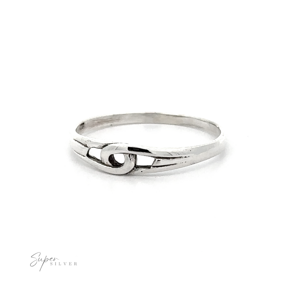 A beautiful silver Freestyle Loop Ring with a knot in the middle, perfect for those who appreciate elegant and unique jewelry pieces.