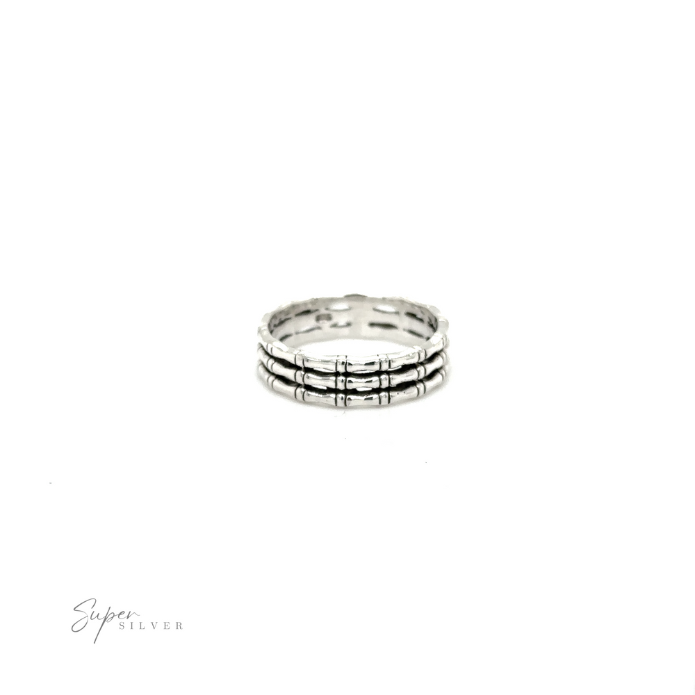
                  
                    A Super Silver Triple Bamboo Band Ring with three rows of diamonds.
                  
                
