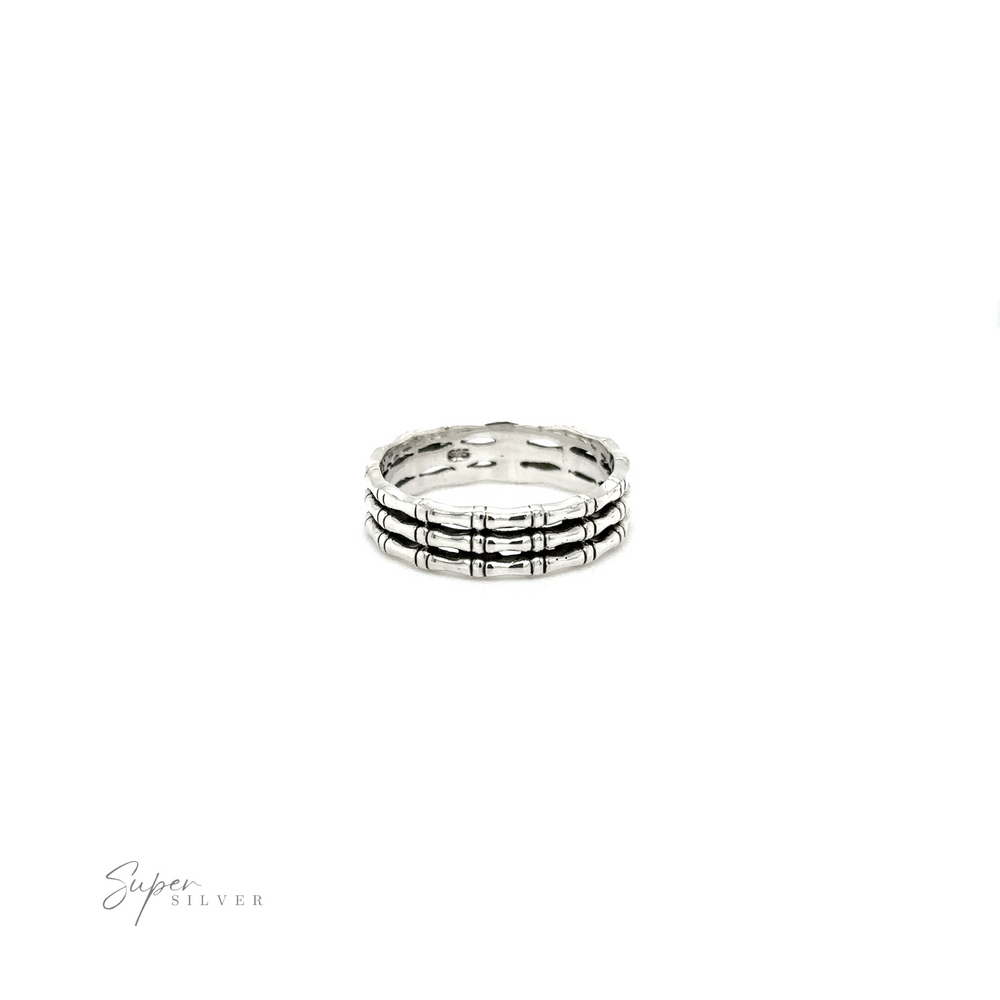 
                  
                    A minimalist style Triple Bamboo Band Ring with black and white stripes from Super Silver.
                  
                