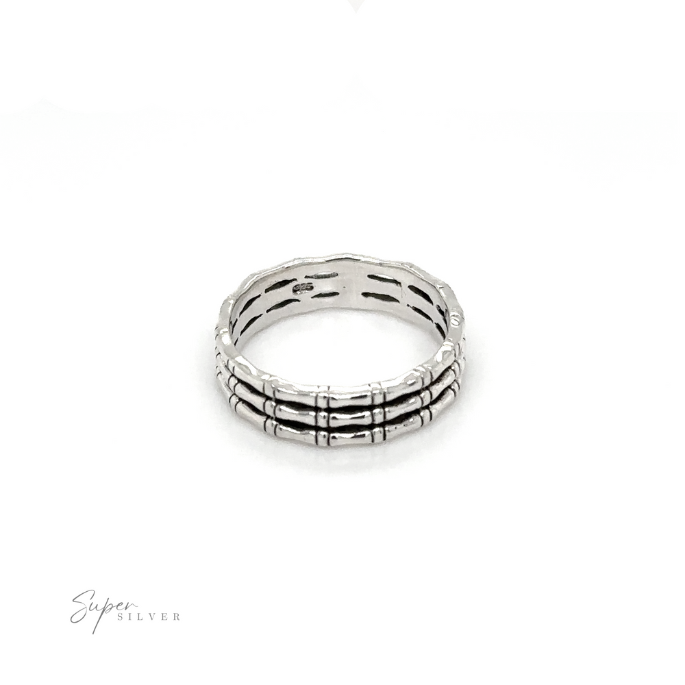 A Triple Bamboo Band Ring with black and white stripes from Super Silver.