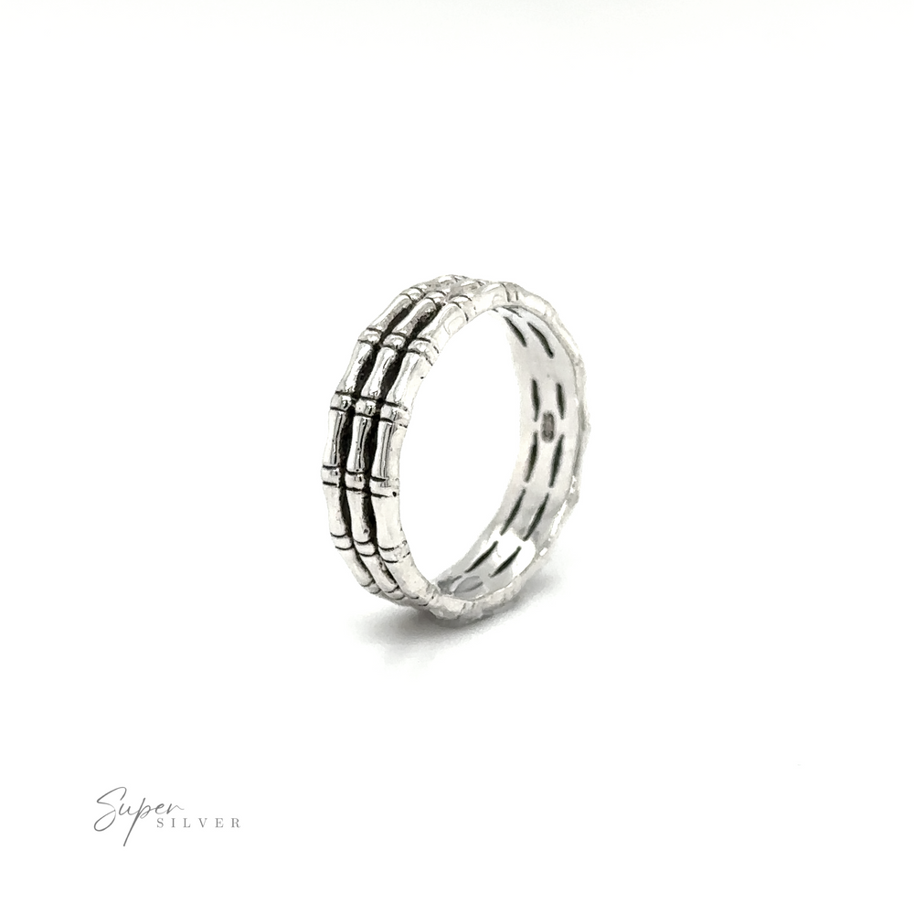 
                  
                    A Triple Bamboo Band Ring with three rows of diamonds in a minimalist style by Super Silver.
                  
                