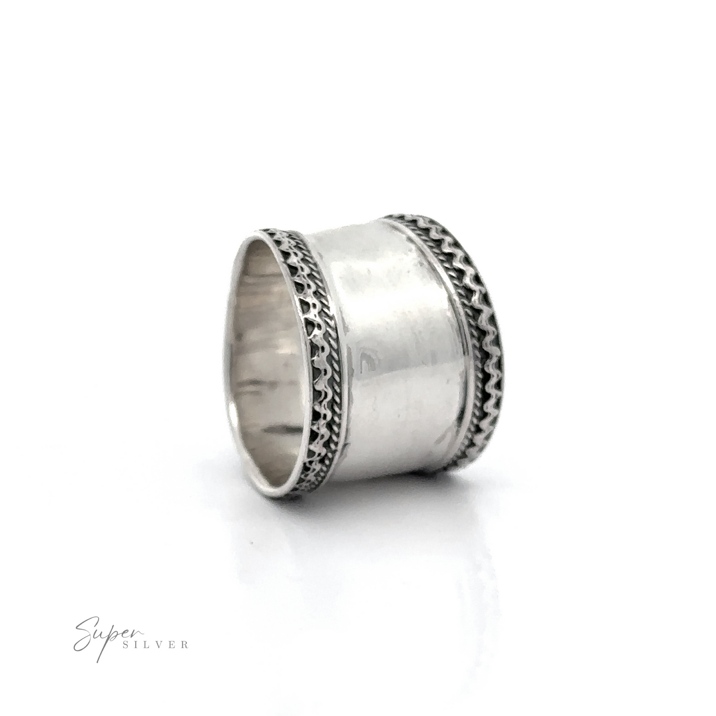 
                  
                    A sterling silver ring with diamonds on a Wide Silver Band with Etched Border.
                  
                