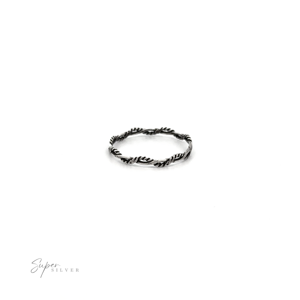 
                  
                    A delicate Tiny Twisted Rope Band ring on a white background.
                  
                
